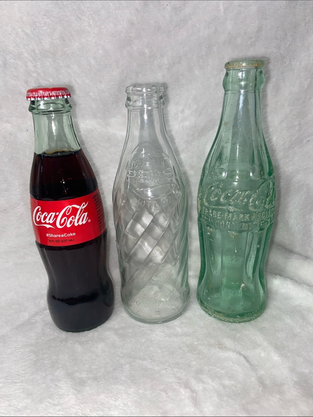 Coca Cola Trio of Clear, Green and Red Glass Bottles